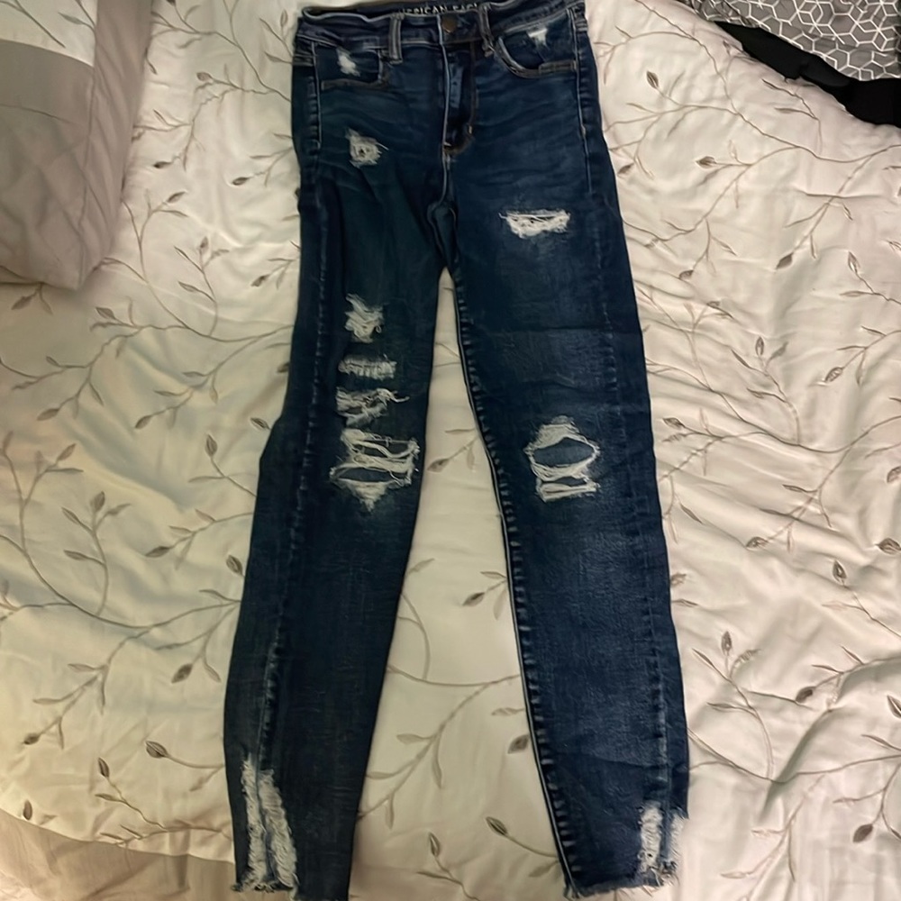 Navy American Eagle ripped jeans. They are stretchy
